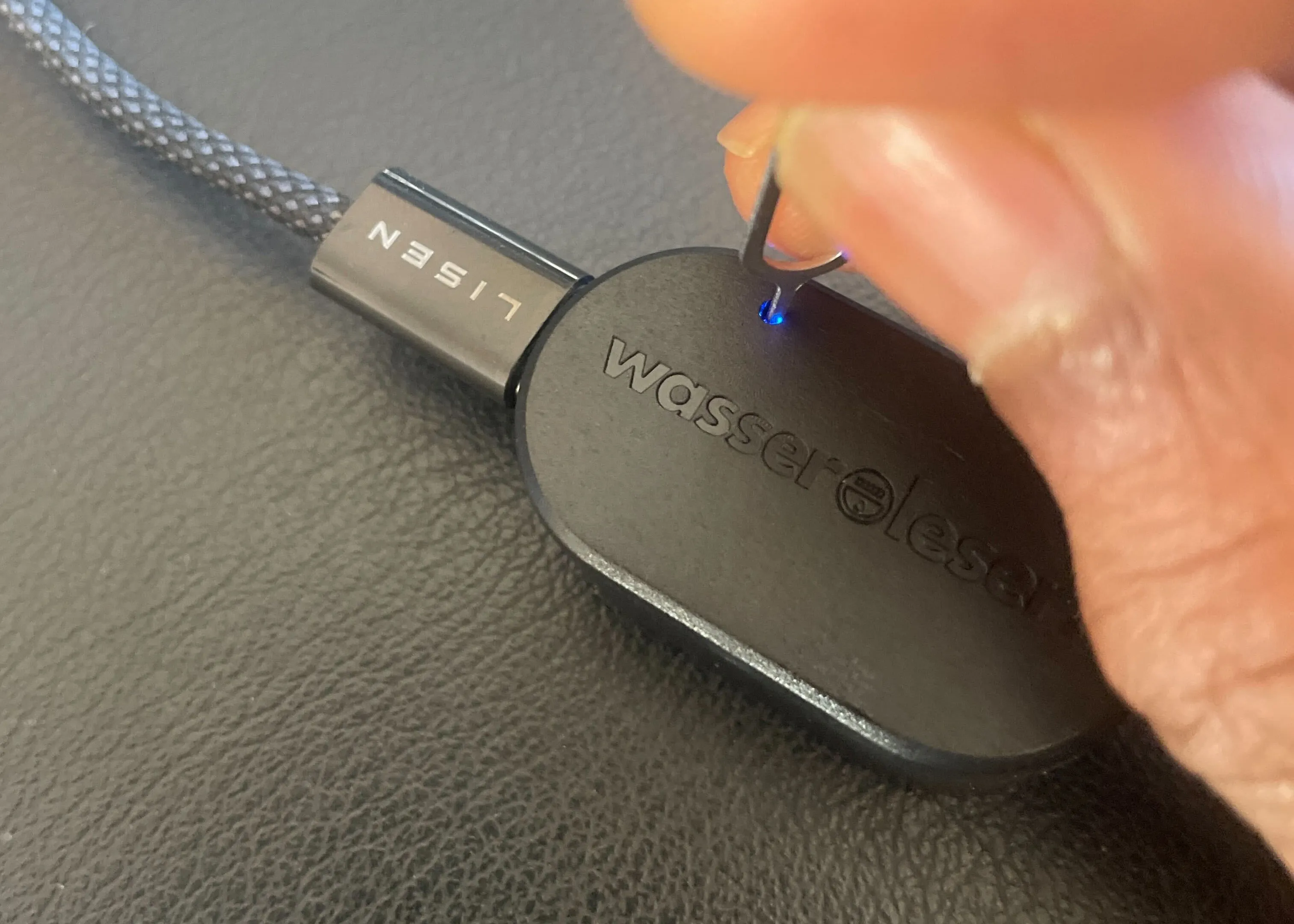 Inserting reset pin into LED opening